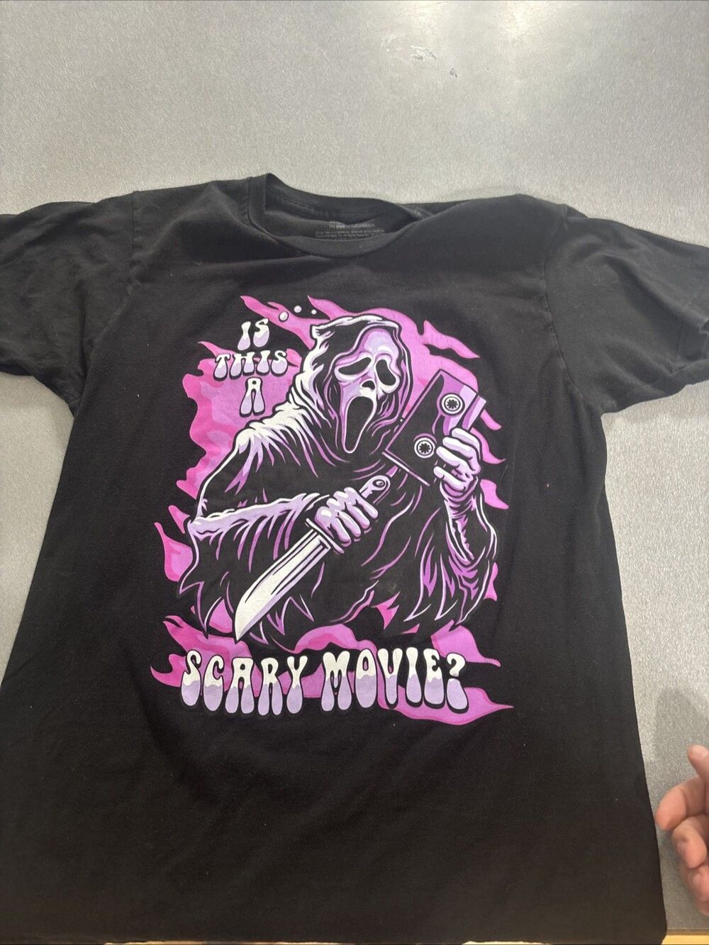 Scream New Adult T-Shirt - Ghostface is This A Scary Movie Purple Image